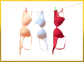 Picture of three bras haning from clothes line