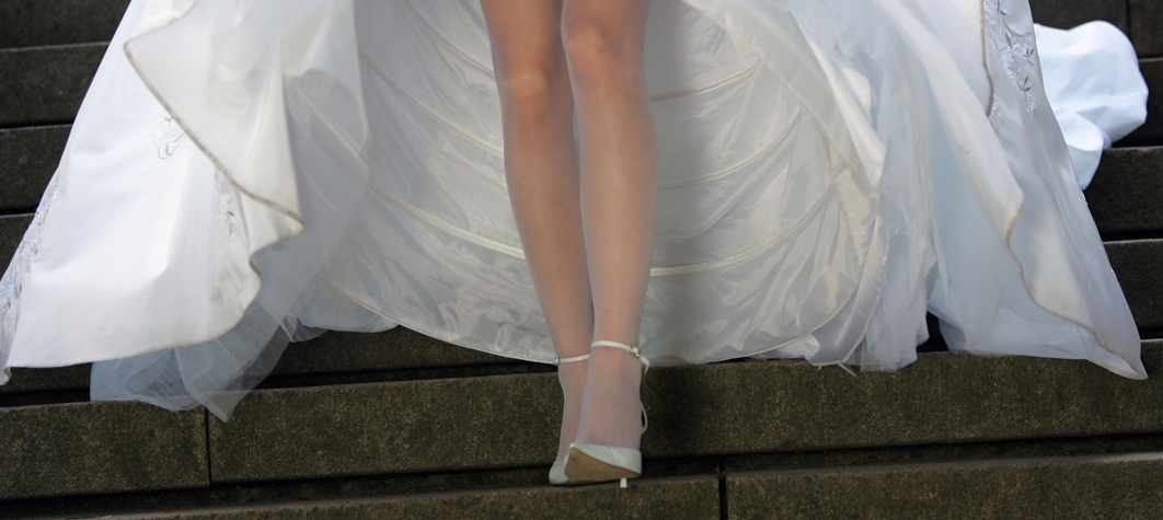 Woman in large white hoop skirt