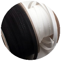 Circular image of white hat ribbon on roll